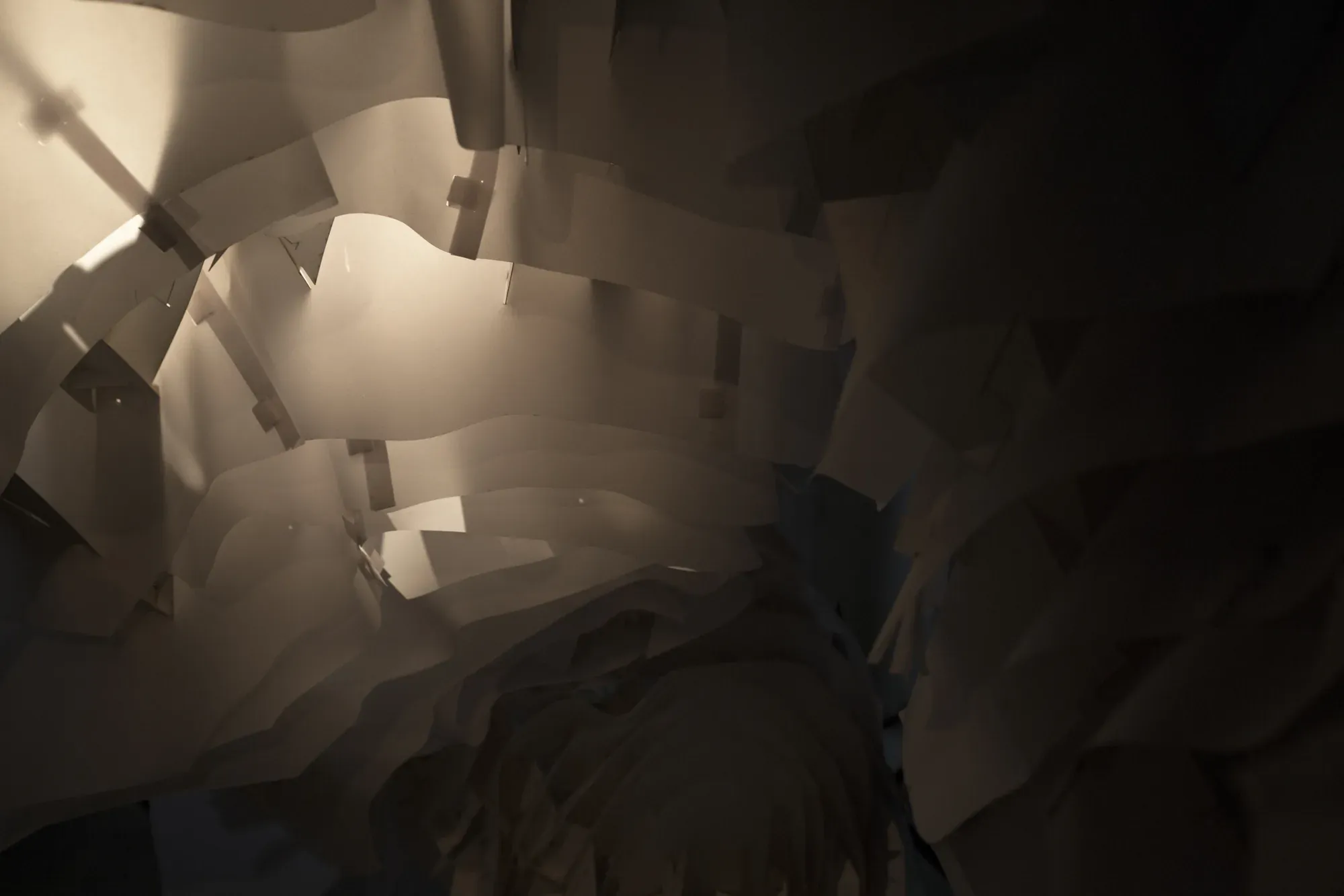Inside the paper structure: layered white sheets and dark gaps, softly lit.